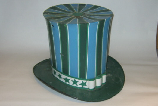 Appraisal: TIN HAT-FORM TRADE SIGN Painted in stripes of blue green