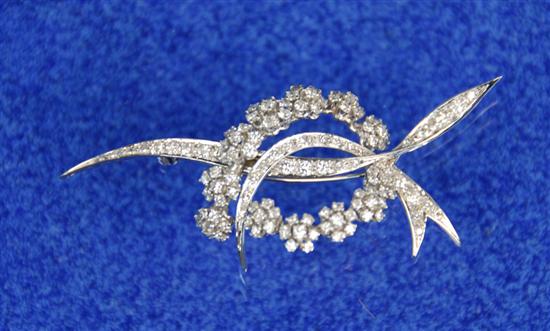 Appraisal: K WHITE GOLD AND DIAMOND FLOWER GARLAND AND RIBBON BROOCH