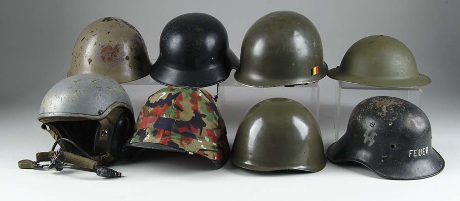 Appraisal: LOT OF MISCELLANEOUS HELMETS Swiss battle helmet with spattered black