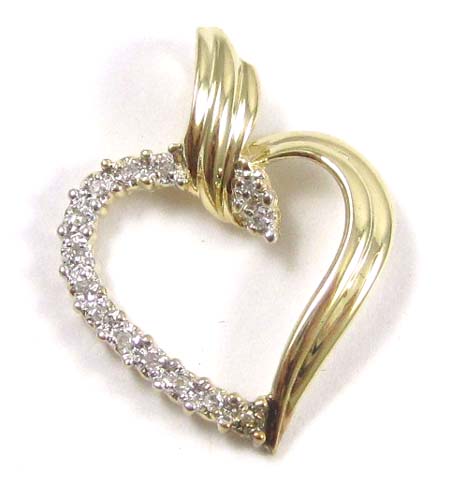 Appraisal: DIAMOND AND FOURTEEN KARAT GOLD PENDANT The open heart pendant