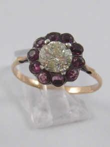 Appraisal: A yellow metal tests gold diamond and garnet ring estimated