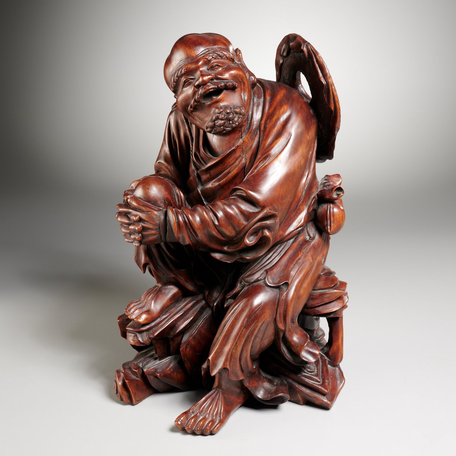 Appraisal: CHINESE CARVED HARDWOOD FIGURE OF SEATED LUOHAN th c the