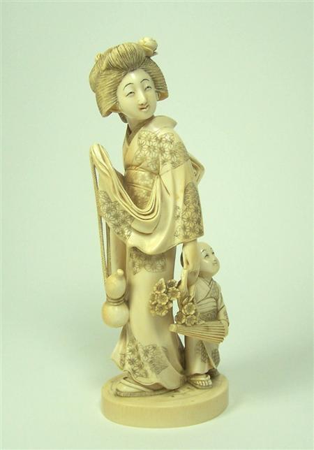 Appraisal: A large Japanese ivory figure of a bejin and child