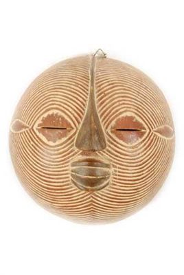 Appraisal: An African mask of convex form with allover reeded and