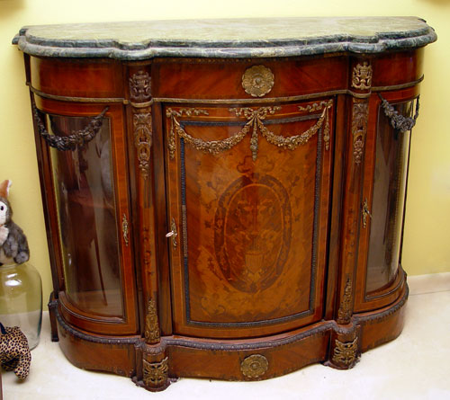 Appraisal: TRIPLE BOWFRONT MARQUETRY SIDE CABINET Marquetry front panel curved glass