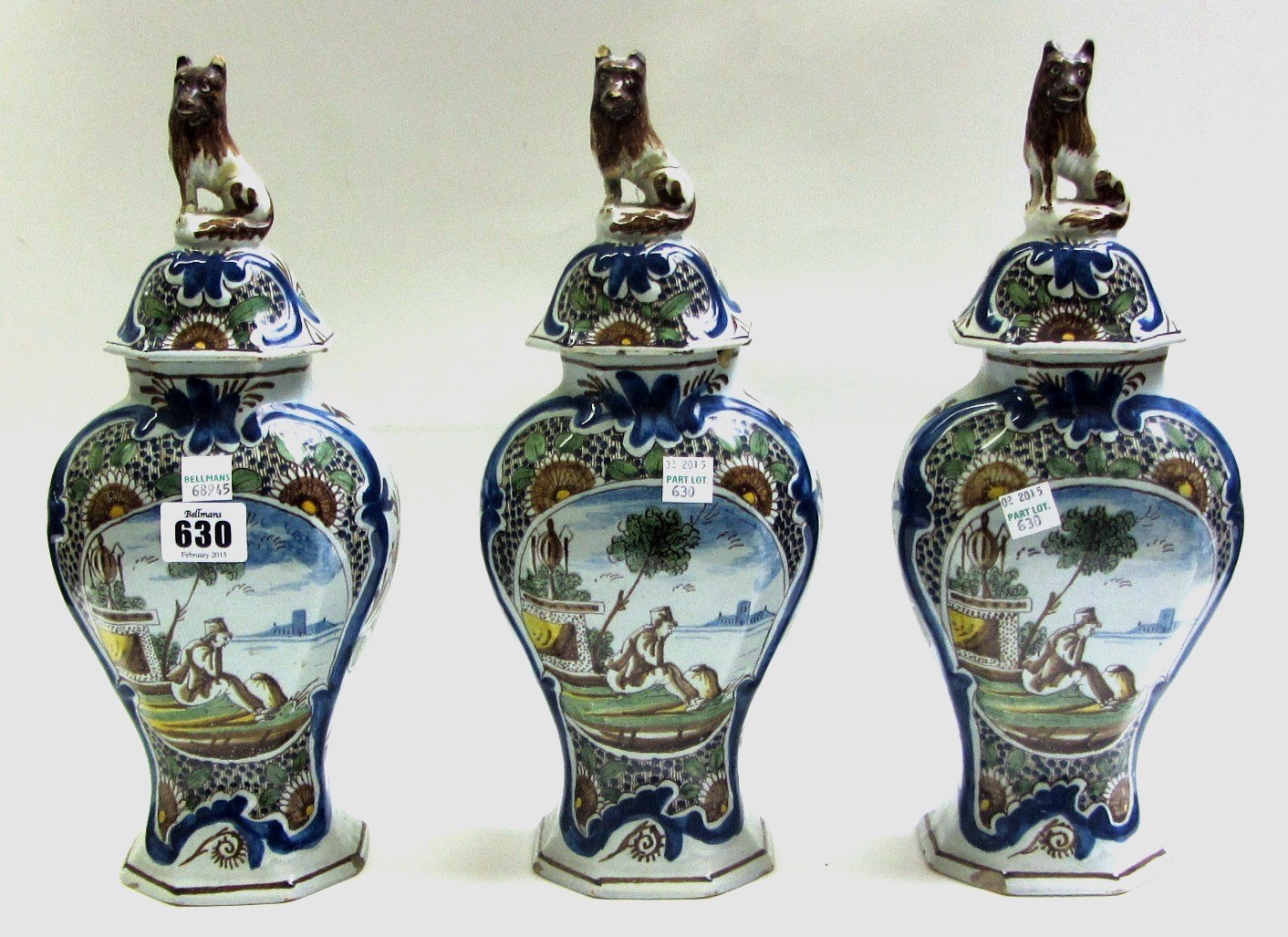 Appraisal: A garniture of Dutch Delft polychrome vases and covers mid