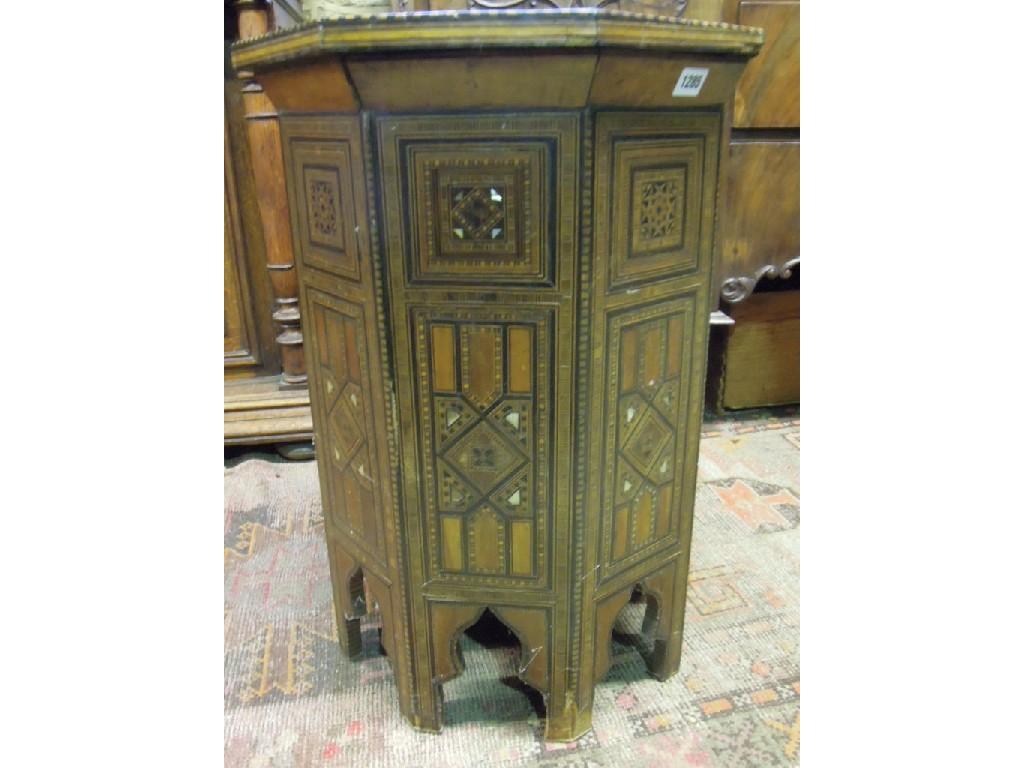 Appraisal: An Eastern occasional table of octagonal form with decorative inlaid