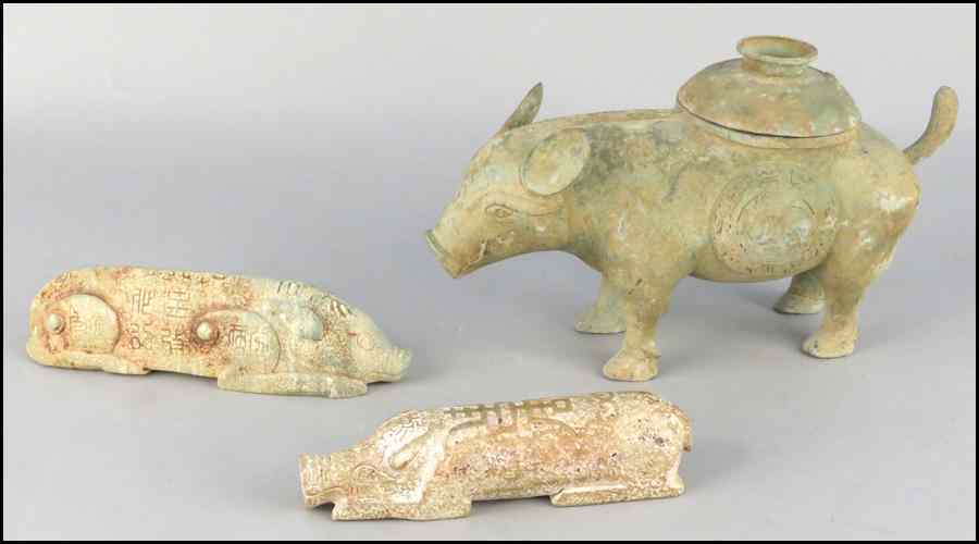 Appraisal: TWO CARVED STONE PIG FORMS Together with a patinated metal