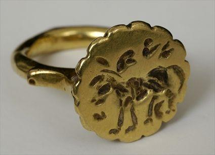 Appraisal: ISLAMIC GOLD RING WITH ANIMAL ENGRAVING Size in Provenance Property