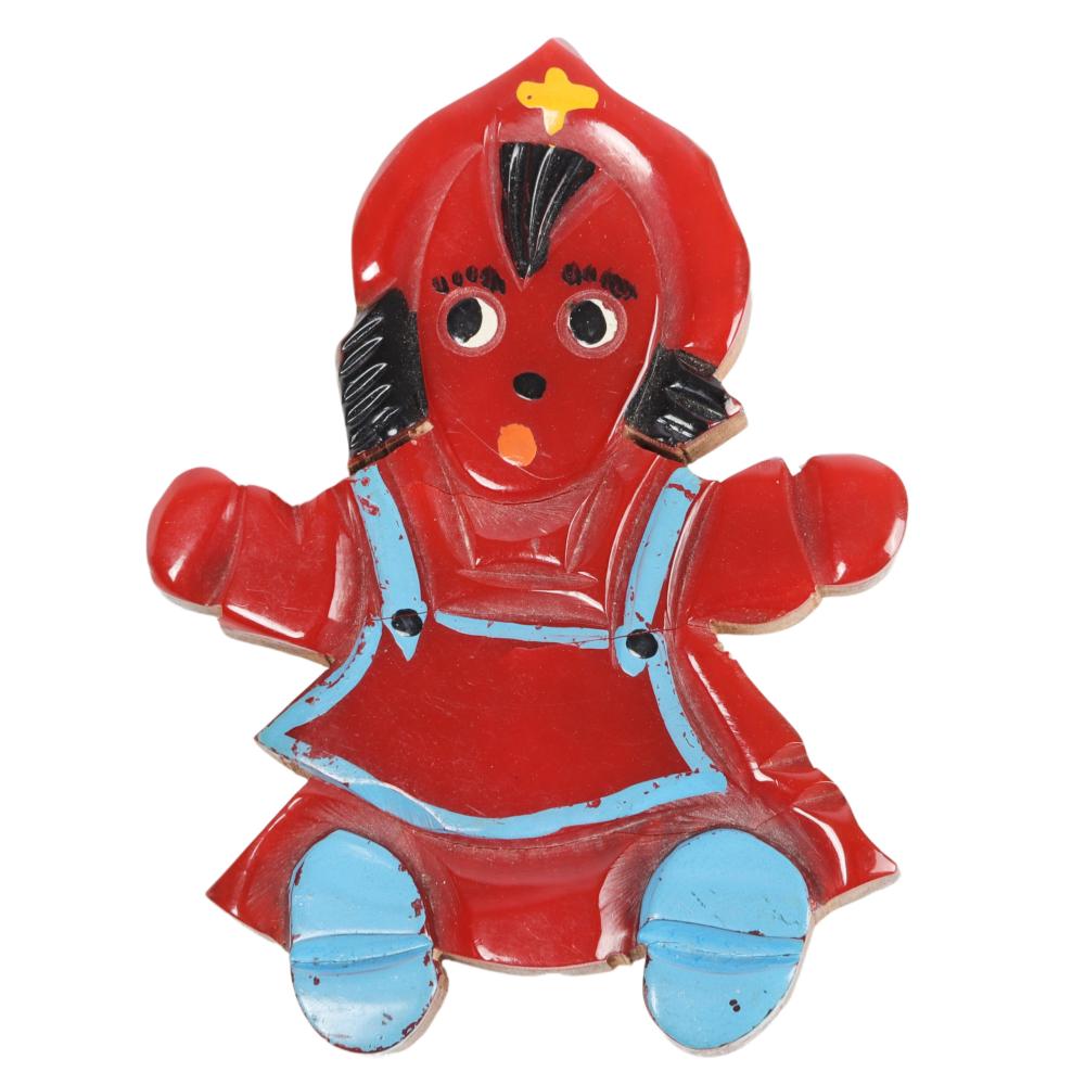 Appraisal: WOODEN BABY DOLL PIN WITH RED BAKELITE OVERLAY H X