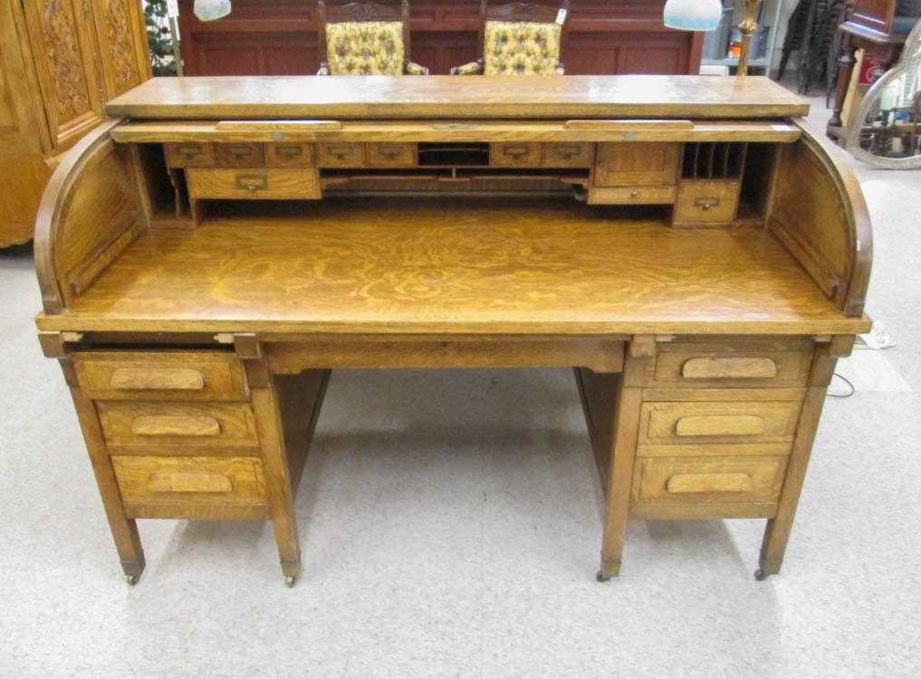 Appraisal: AN OAK ROLL-TOP DESK AND CHAIR Clemco Desk Manufacturing Co