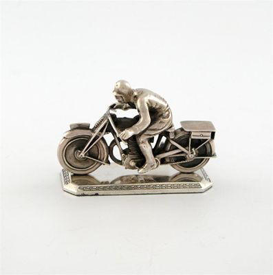 Appraisal: A silver model of a motorcycle and rider possibly by