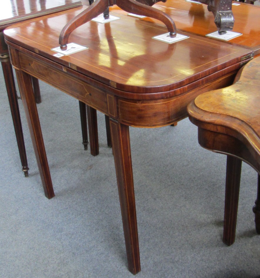 Appraisal: A George III inlaid mahogany tea table on tapering square