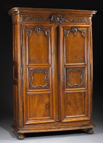 Appraisal: A fine R gence walnut armoire early th century The