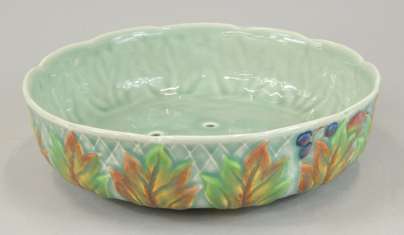 Appraisal: A Clarice Cliff salad drainer moulded in relief with leaves