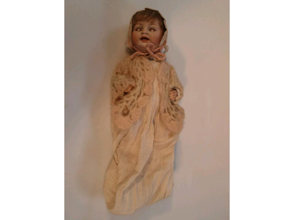 Appraisal: An early thC German bisque head beb doll with a