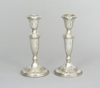 Appraisal: A Pair of Weighted Sterling Silver Candlesticks American ca th