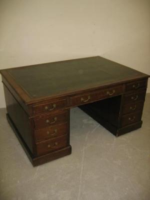 Appraisal: A MAHOGANY PEDESTAL PARTNERS DESK the moulded edged top lined