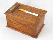 Appraisal: An automatic cigarette dispenser the treen box with brass inlay