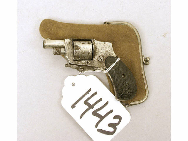 Appraisal: Baby hammerless folding trigger cal revolver in original purse holster