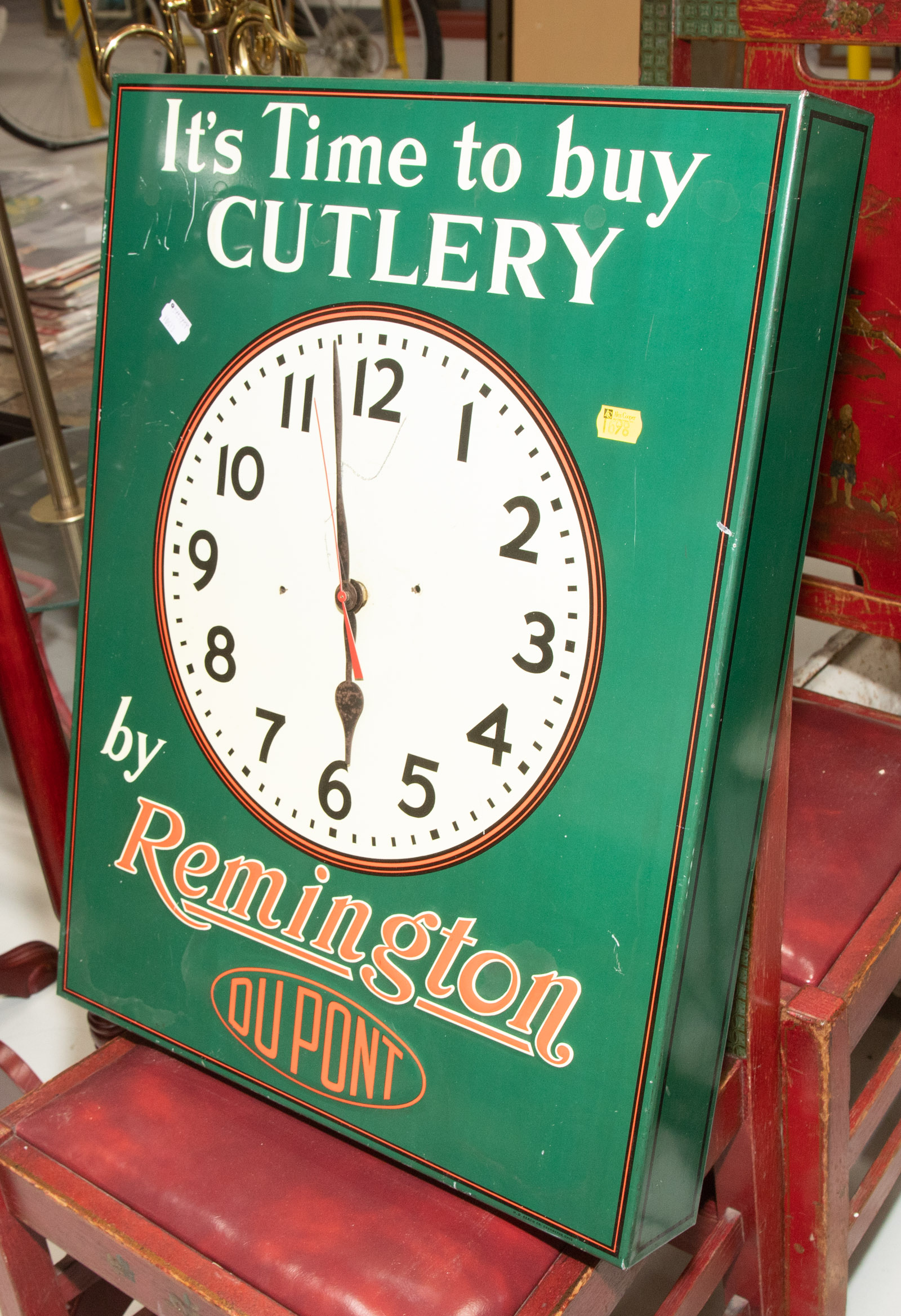 Appraisal: REMINGTON DU PONT ADVERTISING TIN CLOCK Mid th century with