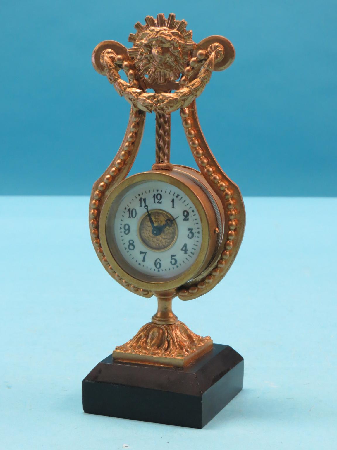 Appraisal: A gilt-metal lyre mantel clock with enamelled dial on square