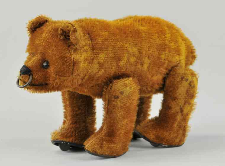 Appraisal: BEAR FLOOR TOY Mohair covering features rollers on feet wire