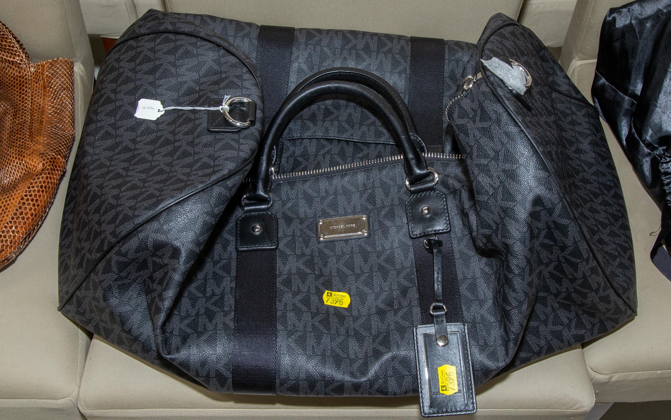 Appraisal: NWT MICHAEL KORS TRAVEL DUFFEL A black and gray monogram