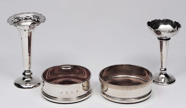 Appraisal: Two modern silver wine coastersof stylised form with turn hardwood