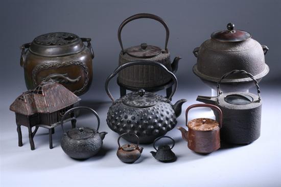 Appraisal: SEVEN JAPANESE CAST IRON TEAPOTS One with stand various forms