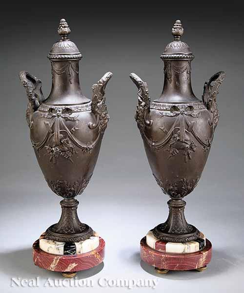 Appraisal: A Pair of Patinated Bronze Urns in the Classical Taste