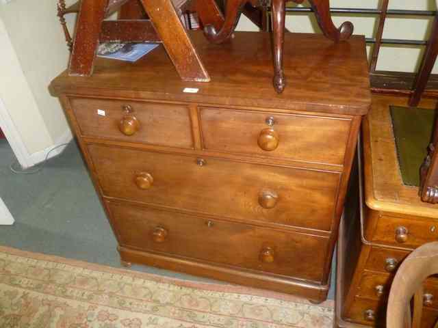 Appraisal: A VICTORIAN MAHOGANY CHEST of two long two short graduated