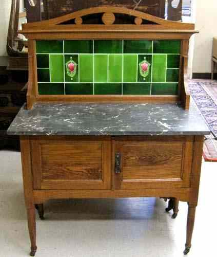 Appraisal: OAK WASHSTAND English c having a green tile backsplash over