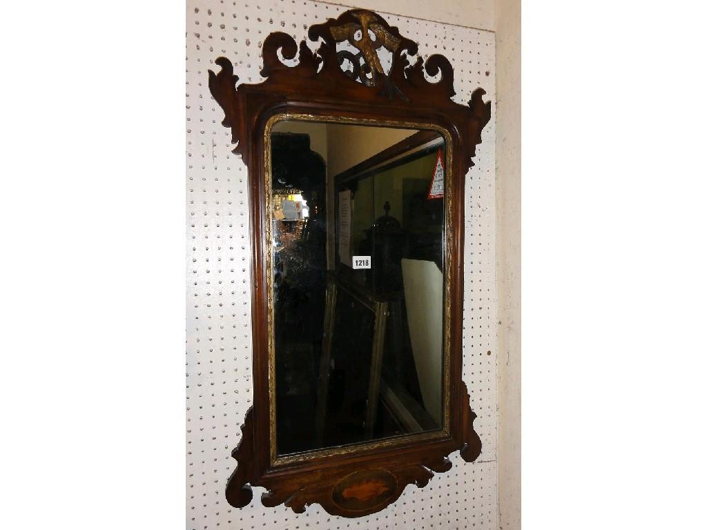 Appraisal: A Georgian style wall mirror with carved fretwork outline and