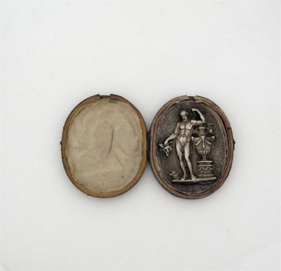 Appraisal: A neo-classical oval plaquette of Bacchus he stands naked next