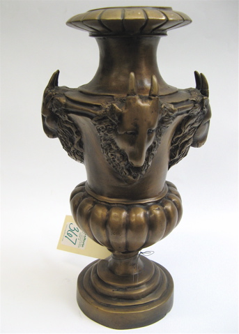 Appraisal: A PEDESTAL BRONZE PATINA VASE metal having four ram head