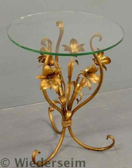 Appraisal: Gilt metal side table with a spray of flowers under