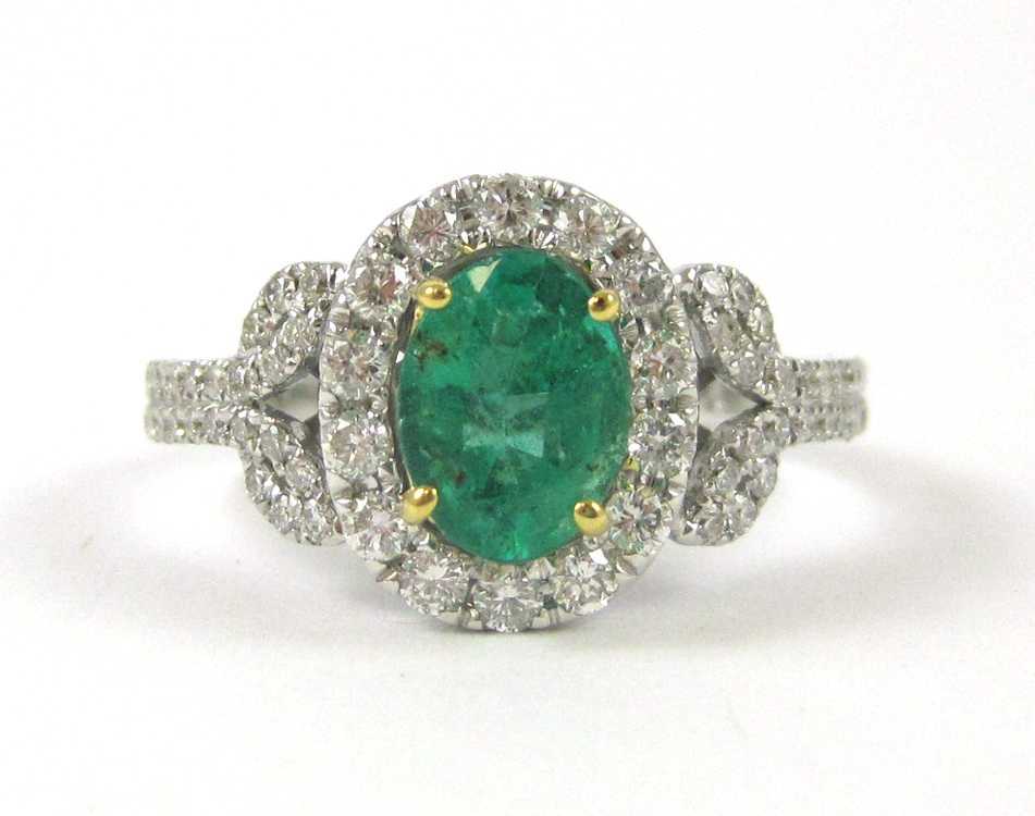 Appraisal: EMERALD DIAMOND AND FOURTEEN KARAT GOLD RING The white and