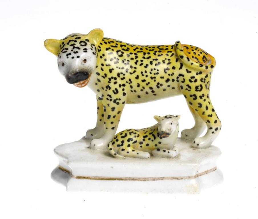 Appraisal: A STAFFORDSHIRE EARTHENWARE GROUP OF A LEOPARD AND CUB POSSIBLY