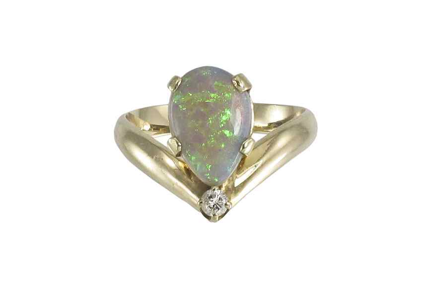 Appraisal: K OPAL DIAMOND RING K yellow gold ring contains one