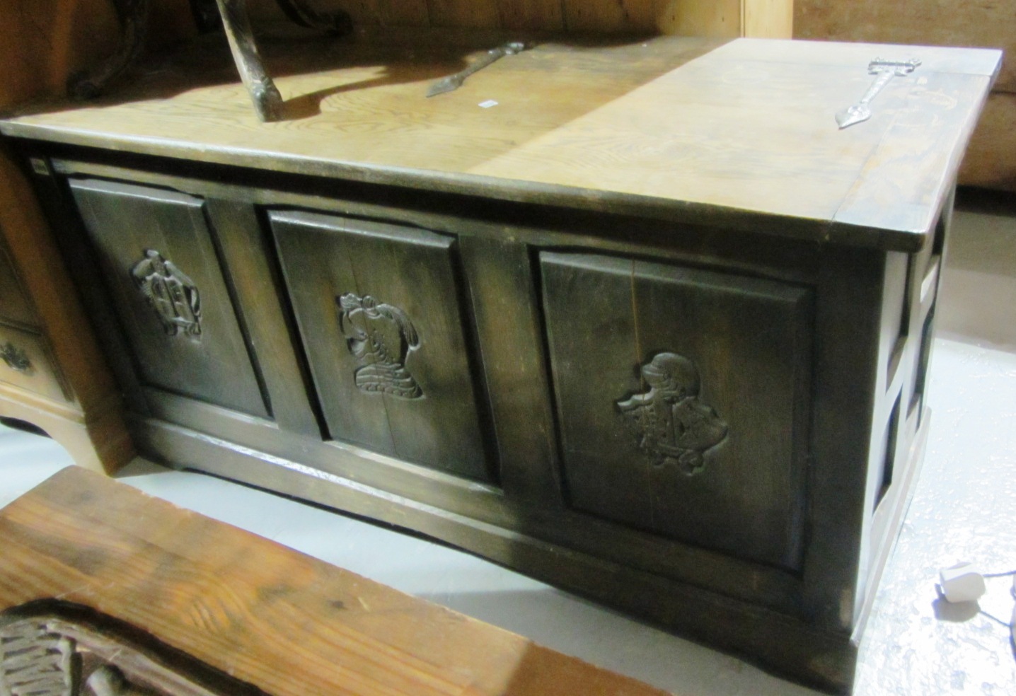 Appraisal: A th century oak coffer with carved triple panel decoration