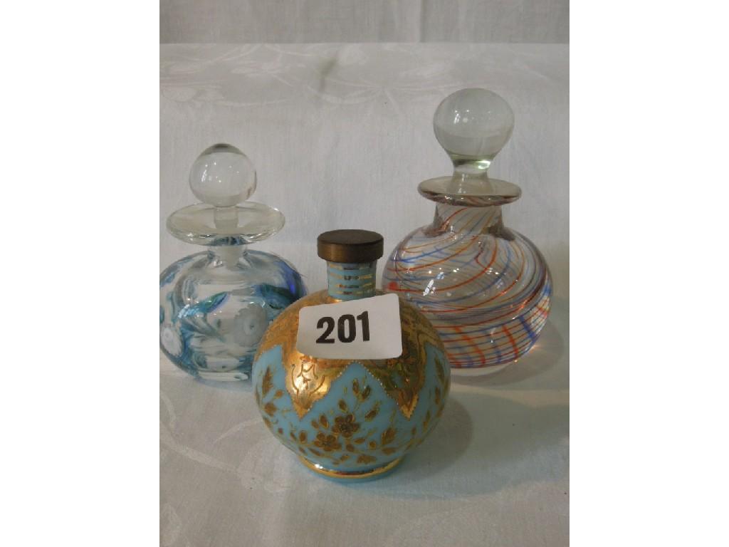 Appraisal: A collection of various decorative glass scent bottles and stoppers