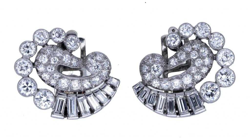 Appraisal: A PAIR OF DIAMOND EARRINGS with round and baguette cut