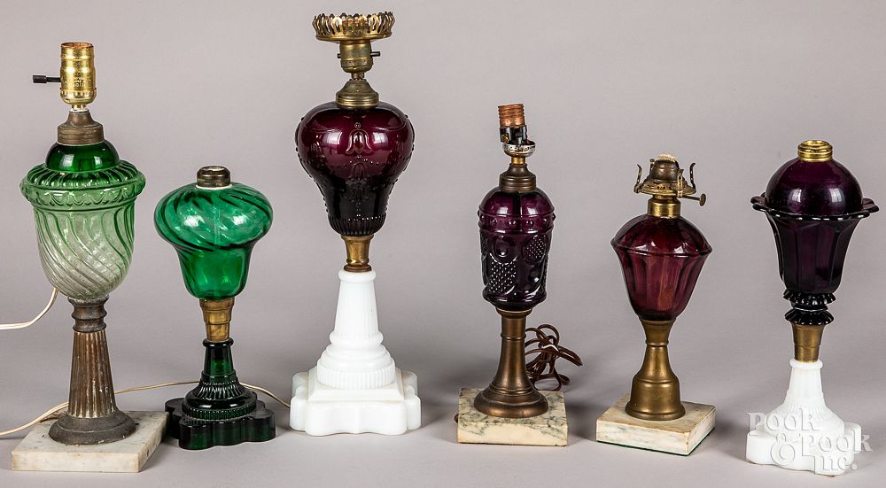 Appraisal: Six colored glass fluid lamps Six colored glass fluid lamps