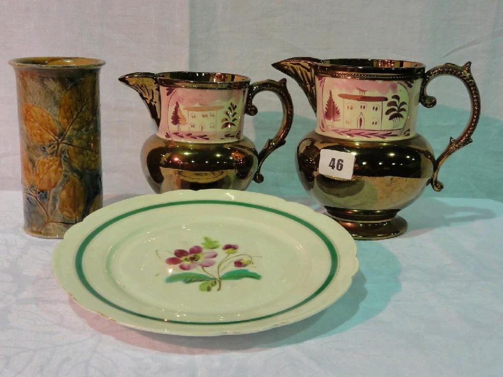 Appraisal: A set of three th century graduated copper lustre jugs