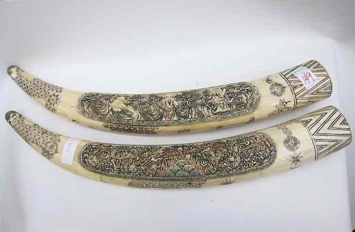 Appraisal: PAIR OF CHINESE PIECED BONE ''TUSK'' SCULPTURES each with central