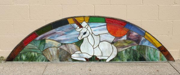 Appraisal: Stained slag glass arched window with unicorn at center L