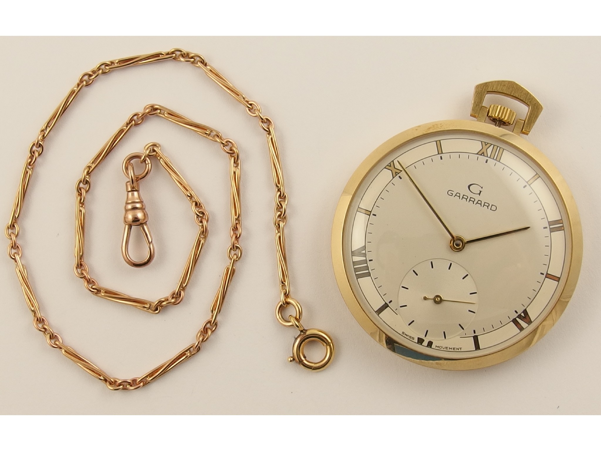 Appraisal: A ct Garrard pocket watch and decorative Albert chainthe inner