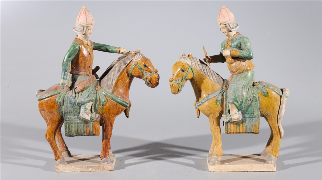 Appraisal: Pair of Chinese early style sancai glazed riders each with