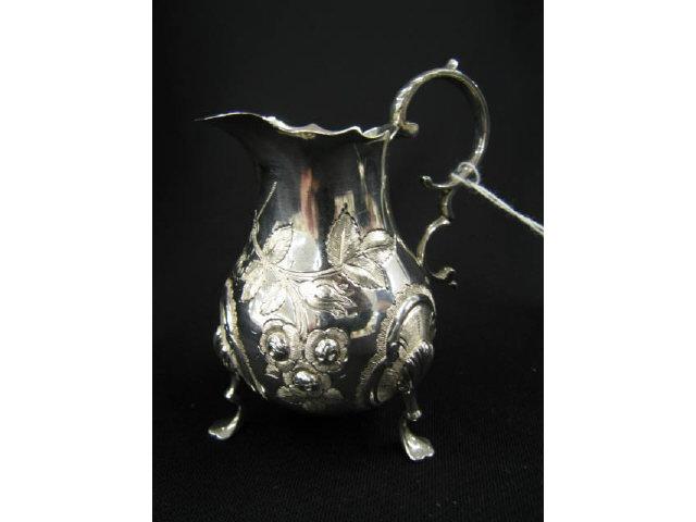 Appraisal: English Sterling Silver Cream Pitcher footed repousse floral excellent